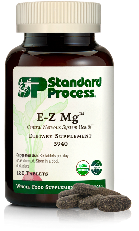 Image of E-Z Mg bottle next to tablets of magnesium supplements.